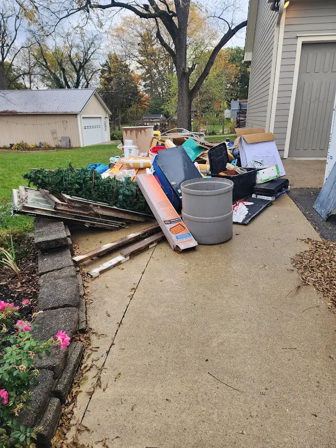 Dumpster being loaded with debris for Commercial Dumpster Rental in Newington Forest